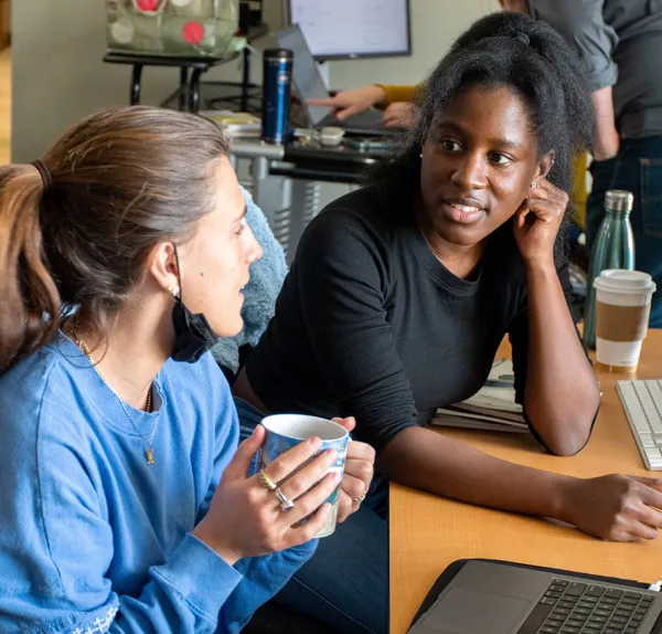 Two people looking at each other as they interact.