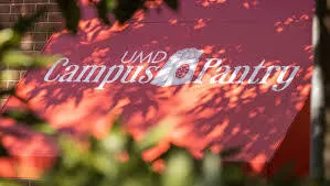 A red awning with the words "UMD Campus Pantry."