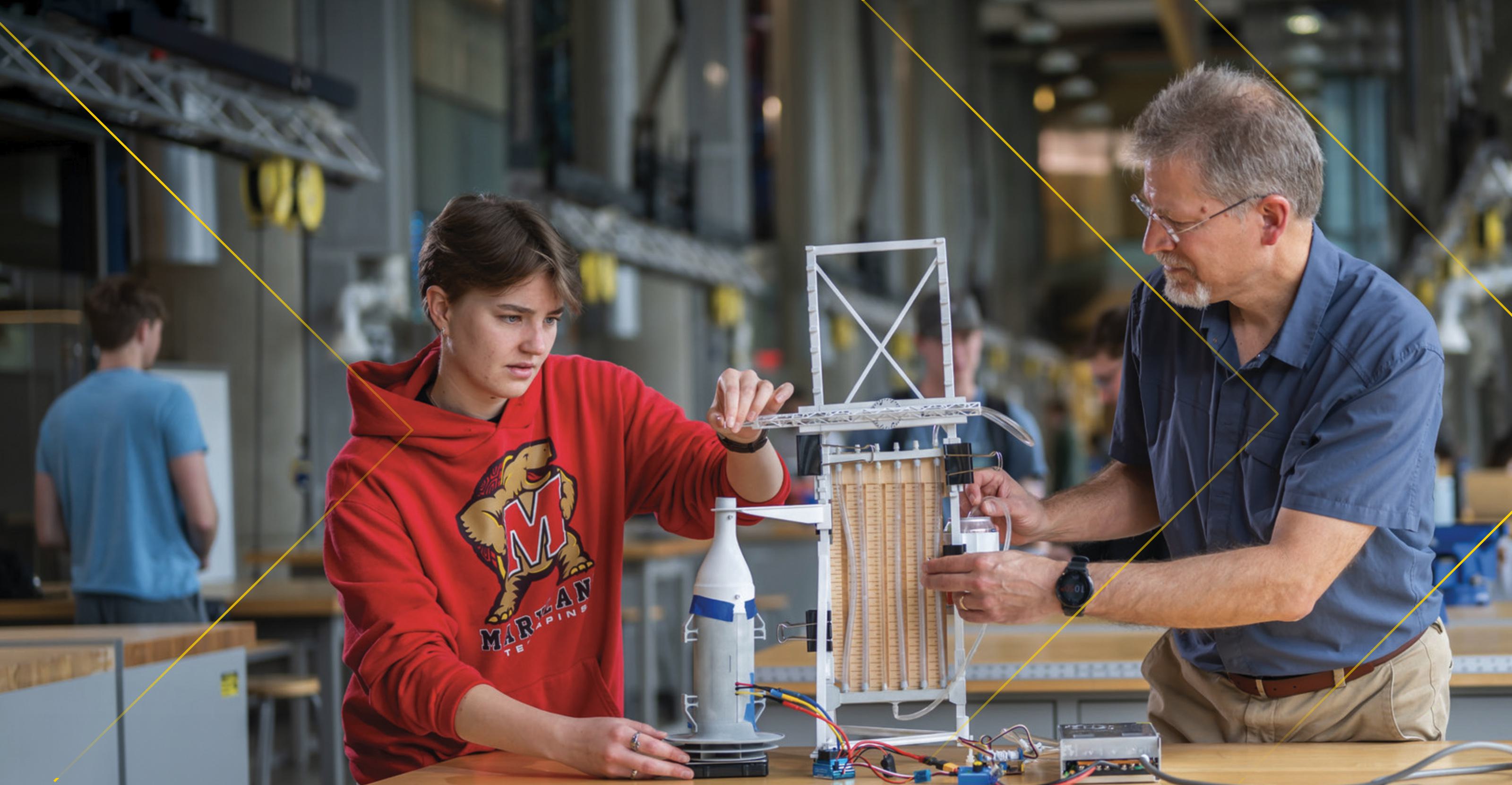 Student and professor working on an engineering project