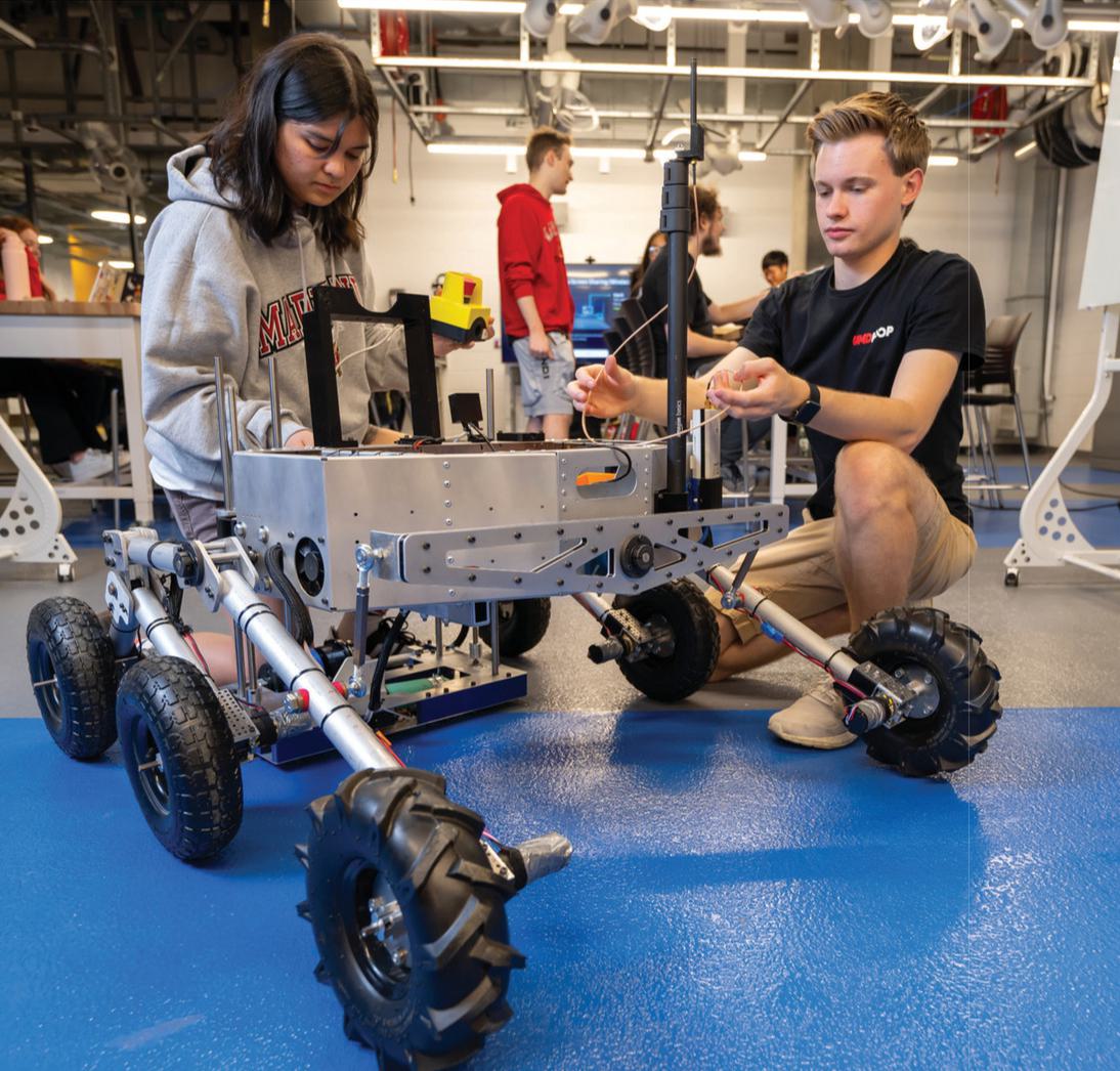 Students working on a robot in a lab/classroom